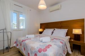 Posteľ alebo postele v izbe v ubytovaní Apartments Knego