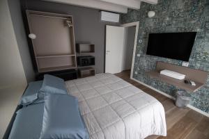 Кровать или кровати в номере Relais del Garda
