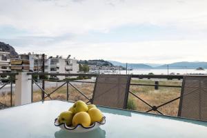 a toy duck on a table with a view of the water at Amazing View Family Penthouse in Nafplio