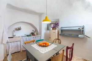 A cozinha ou kitchenette de Trulli 18cinquantanove