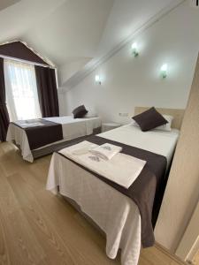 Postel nebo postele na pokoji v ubytování Nefis Hotel Ölüdeniz