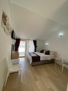 Postel nebo postele na pokoji v ubytování Nefis Hotel Ölüdeniz