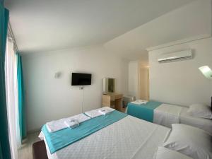 Postel nebo postele na pokoji v ubytování Nefis Hotel Ölüdeniz