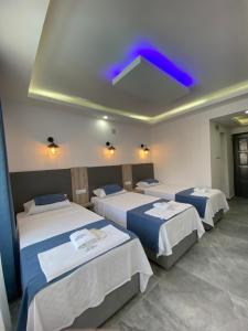 Postel nebo postele na pokoji v ubytování Nefis Hotel Ölüdeniz