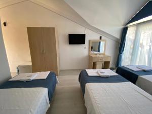 Postel nebo postele na pokoji v ubytování Nefis Hotel Ölüdeniz