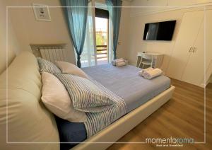 Postel nebo postele na pokoji v ubytování Momentoroma b&b