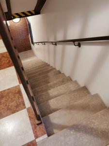 a staircase in a building with a metal railing at Ca Cristallina in Venice