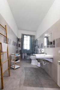 a bathroom with a toilet and a sink at Il Glicine in Marsala