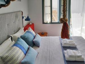 Кровать или кровати в номере Anemone Residence