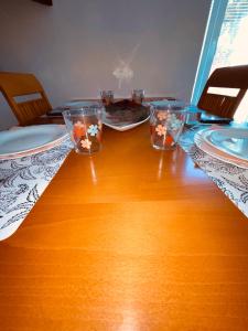 a table with three glasses on top of it at Blue Sky in Koper