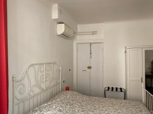 Postel nebo postele na pokoji v ubytování B&B DORMIRE DAI GRIMALDI