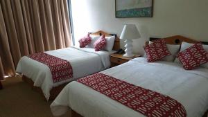 Postel nebo postele na pokoji v ubytování Hotel Chacao Cumberland