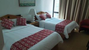 Postel nebo postele na pokoji v ubytování Hotel Chacao Cumberland