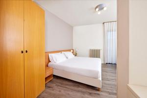 Postel nebo postele na pokoji v ubytování Hotel Royal Village