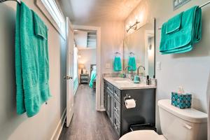 a bathroom with a sink and a toilet at Modern Oak Island Escape 1 Mile to Long Beach! in Oak Island