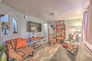 a living room with a couch and a chair at Charming Apartment Less Than 1 Mi to Logan River and Zootah! in Logan