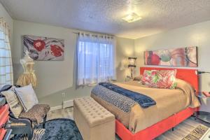 a bedroom with a bed and a chair at Charming Apartment Less Than 1 Mi to Logan River and Zootah! in Logan