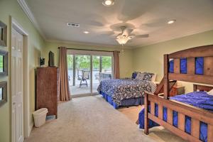 a bedroom with two beds and a ceiling fan at Inviting Family Abode with Dock on Norris Lake! in Caryville
