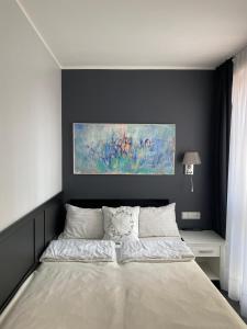 Postel nebo postele na pokoji v ubytování Hotel Amber Suite Enklawa dla Dorosłych