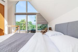 Ένα ή περισσότερα κρεβάτια σε δωμάτιο στο Happy Day Apartment, By Cohost