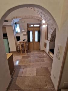 an archway leading into a room with a door at Opera Prima - Luxury Homes in Ceglie Messapica +4 photos