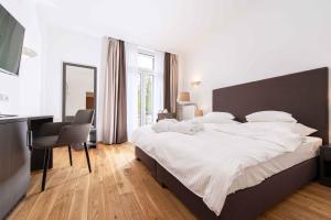 Кровать или кровати в номере Laudensacks Parkhotel & Retreat