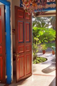 an open door with a view of a yard at Balsora Hotel Boutique in La Tebaida