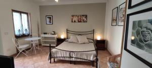 A bed or beds in a room at Affittacamere Angela