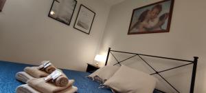 A bed or beds in a room at Affittacamere Angela