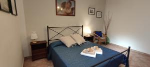 A bed or beds in a room at Affittacamere Angela