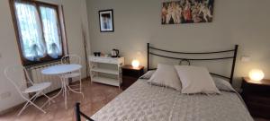 A bed or beds in a room at Affittacamere Angela