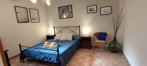 A bed or beds in a room at Affittacamere Angela