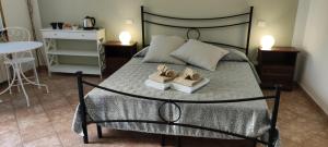 A bed or beds in a room at Affittacamere Angela