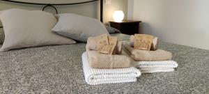A bed or beds in a room at Affittacamere Angela