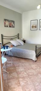 A bed or beds in a room at Affittacamere Angela