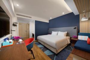 Postel nebo postele na pokoji v ubytování Holiday Inn Express Zhangjiagang East by IHG