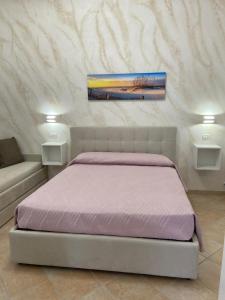 Postel nebo postele na pokoji v ubytování B&B Casa Denittis