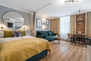 Posteľ alebo postele v izbe v ubytovaní Apartamenty ZŁOTY PIERNIK