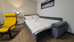 Posteľ alebo postele v izbe v ubytovaní Kadarka apartman - Szekszárd