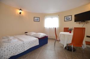Postel nebo postele na pokoji v ubytování Zminj Apartments