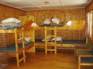 A bunk bed or bunk beds in a room at HI Mosquito Creek Hostel