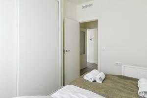 Łóżko lub łóżka w pokoju w obiekcie Málaga estación centro playa