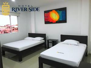 Hotel River Side客房内的一张或多张床位