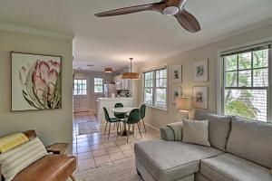 a living room with a couch and a ceiling fan at Charming Boho Breeze Retreat with Pool Access in Key West