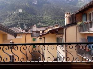 a view from a balcony of buildings with a mountain at Appartamento centro storico in Riva del Garda