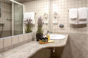 a bathroom with a sink and a mirror at Hotel Podstine in Hvar