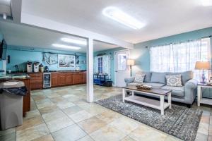 a living room with a couch and a table at Sea View Motel in Ogunquit