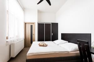 Postel nebo postele na pokoji v ubytování Hotel Jordánek