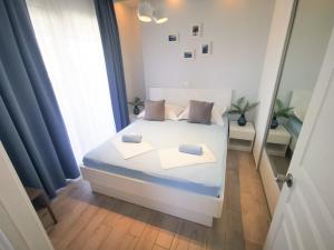 Postel nebo postele na pokoji v ubytování Rita Apartments - Sea-view apartment 2plus1