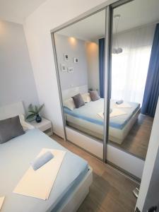 Postel nebo postele na pokoji v ubytování Rita Apartments - Sea-view apartment 2plus1